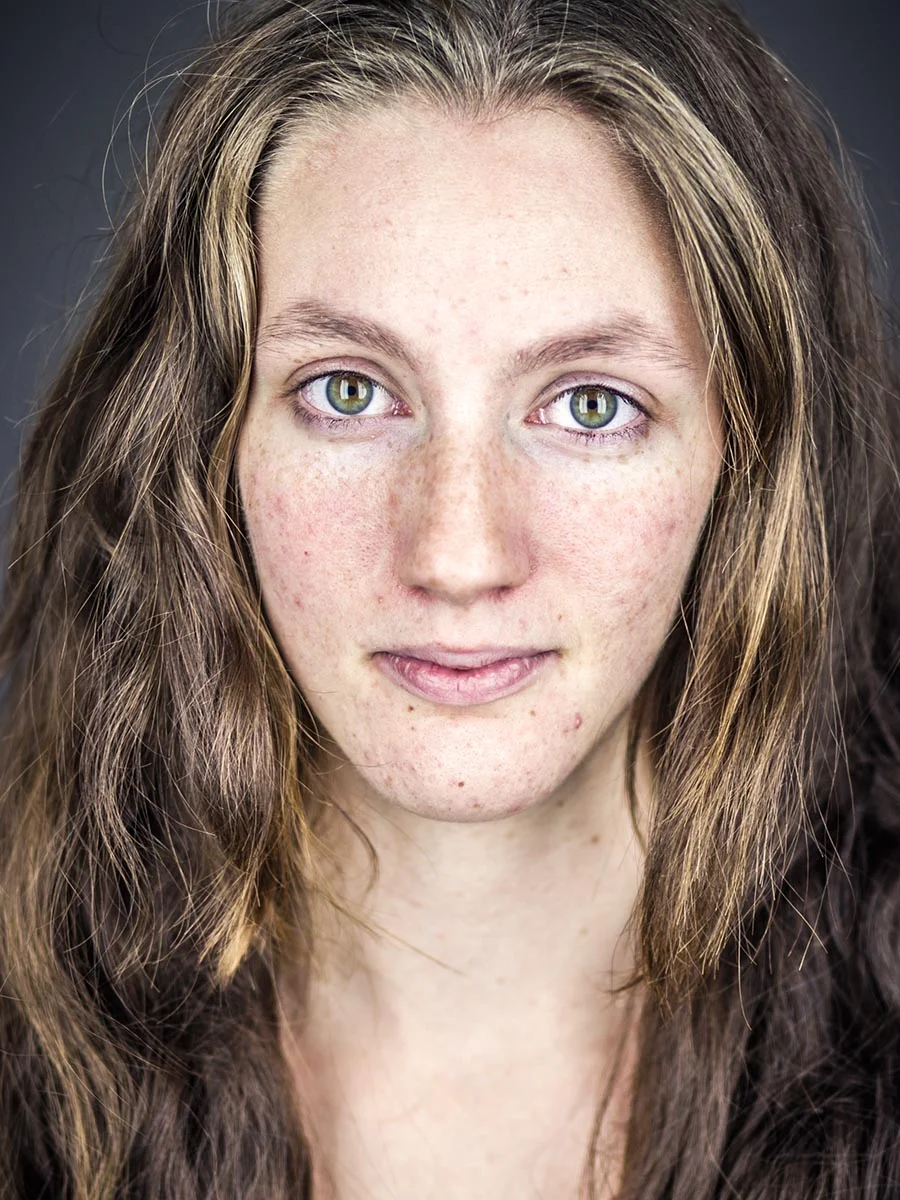 This series of Raw Portraits (Mugs) was created to show the raw beauty of humans. As people were coming in for headshots, I asked them to sit in front of the camera without having any makeup applied, without their hair being done. Then with simple post processing the texture was brought out and skin was slightly desaturated.
