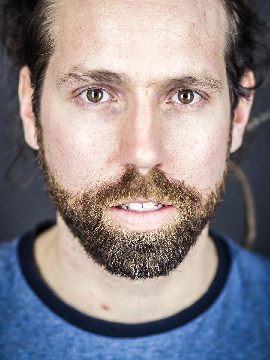 This series of Raw Portraits (Mugs) was created to show the raw beauty of humans. As people were coming in for headshots, I asked them to sit in front of the camera without having any makeup applied, without their hair being done. Then with simple post processing the texture was brought out and skin was slightly desaturated.