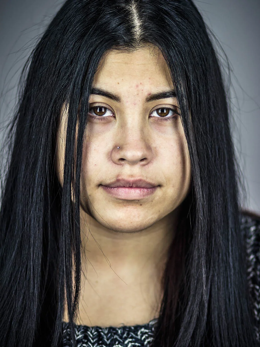 This series of Raw Portraits (Mugs) was created to show the raw beauty of humans. As people were coming in for headshots, I asked them to sit in front of the camera without having any makeup applied, without their hair being done. Then with simple post processing the texture was brought out and skin was slightly desaturated.