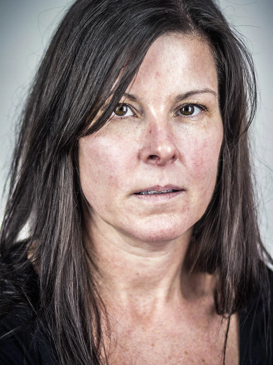 This series of Raw Portraits (Mugs) was created to show the raw beauty of humans. As people were coming in for headshots, I asked them to sit in front of the camera without having any makeup applied, without their hair being done. Then with simple post processing the texture was brought out and skin was slightly desaturated.