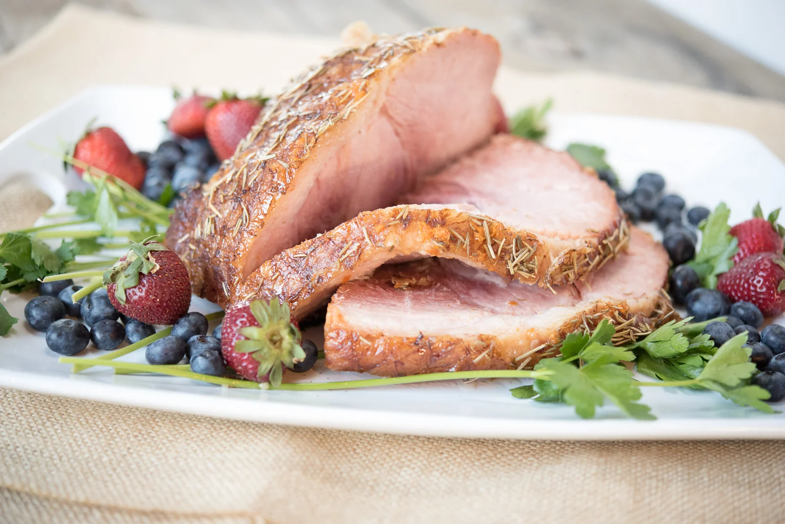 Our Christmas Eve Dinner Menu features traditional Family favorites like this easy Slow Cooker Baked Ham. Pair it with Au Gratin potatoes and lemon garlic green beans for a delicious holiday menu the whole family will love!