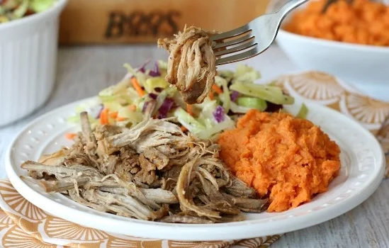 This easy Slow Cooker Apple Cider Pulled Pork makes getting a delicious meal on the table a snap! Plus, there's lots of leftovers for making quick-n-easy future meals too!