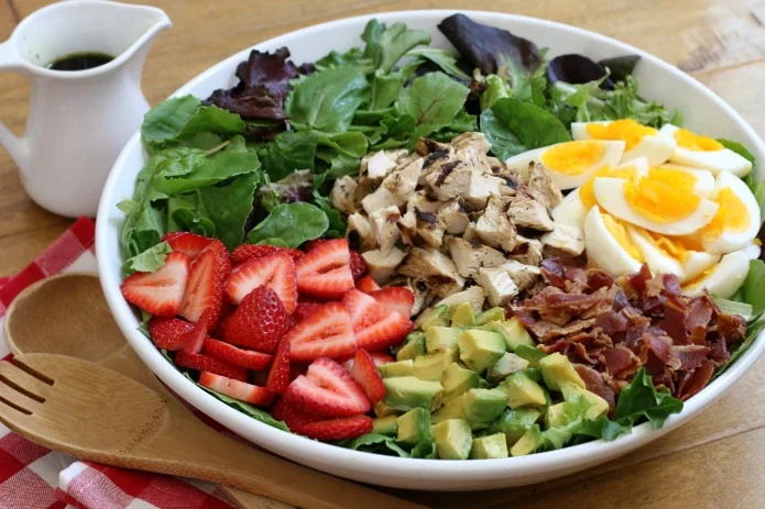 This sweet and savory Strawberry Cobb Salad makes a delightful weeknight dinner, or serve it buffet-style for a beautiful dish perfect for summer entertaining!