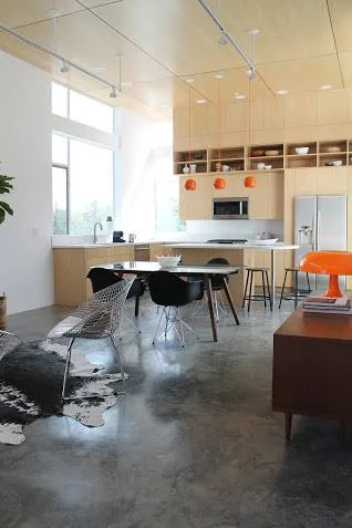 We brought in a Nesso for Artemide-style bright orange mushroom lamp to tie into the kitchen's awesome pendant lights
