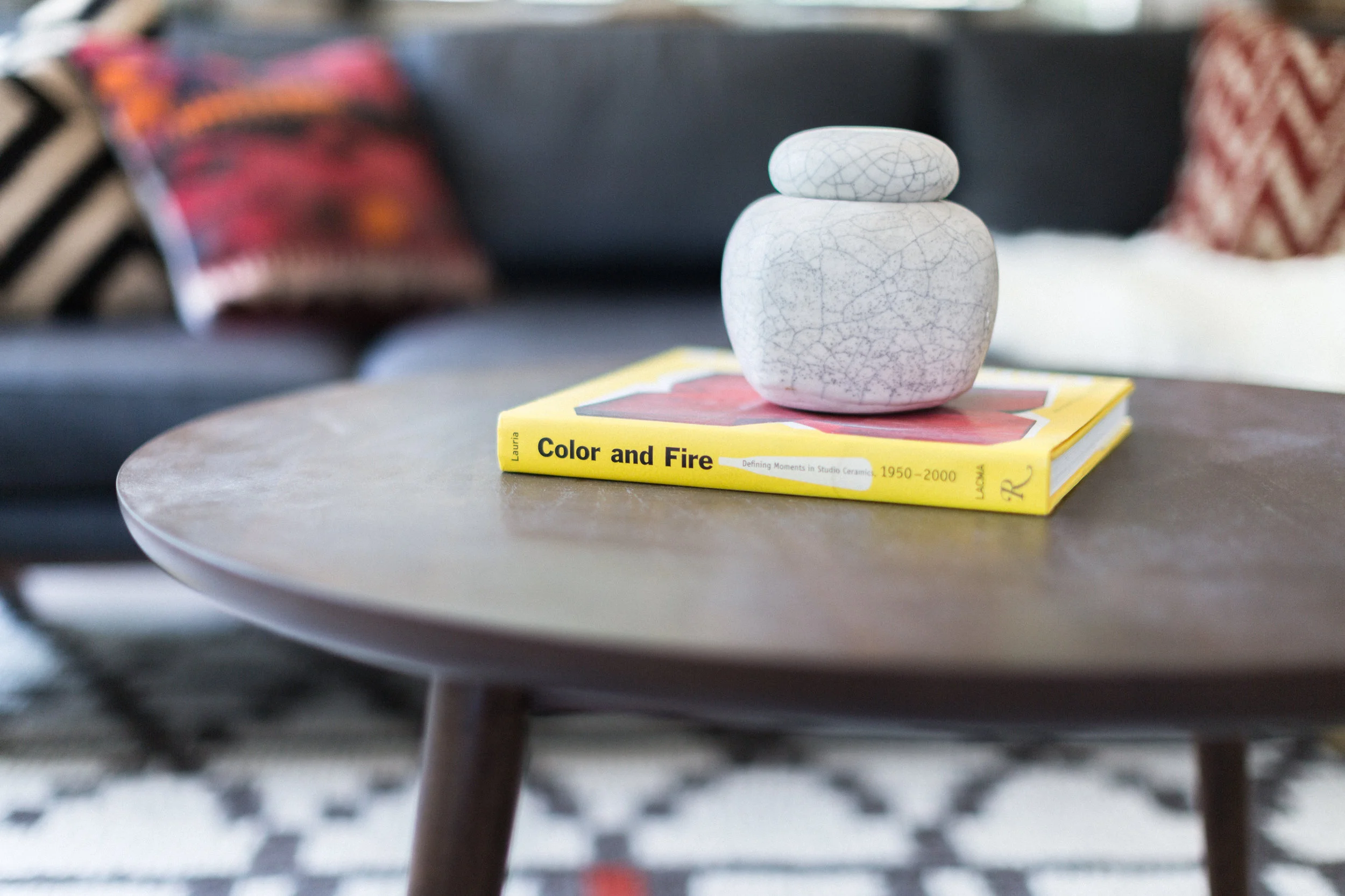 Our second bold accent color - yellow - makes an appearance in the form of a coffee table book. The Mid Century modern coffee table is a World Market find. We shop EVERYWHERE. Yes, you've probably seen us out there.