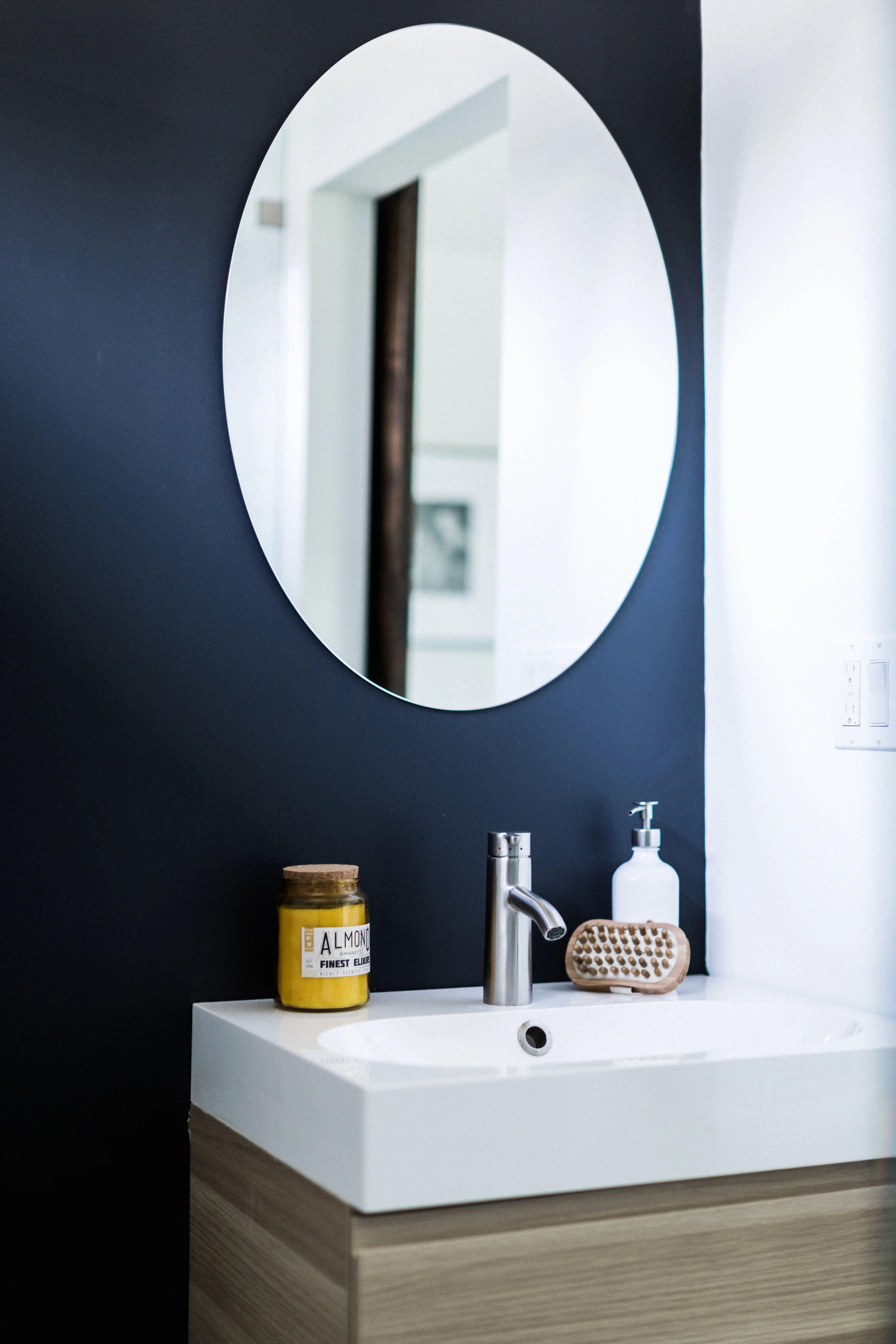 Master bath detail. The dark walls carry the contrast theme throughout the house.