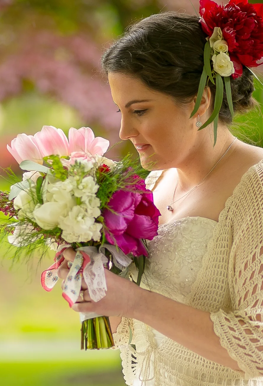 A bouquet of peonies, roses, tulips and in-season greenery is perfect for a springtime wedding. Wrap it up in a vintage hankie for those tearful moments.