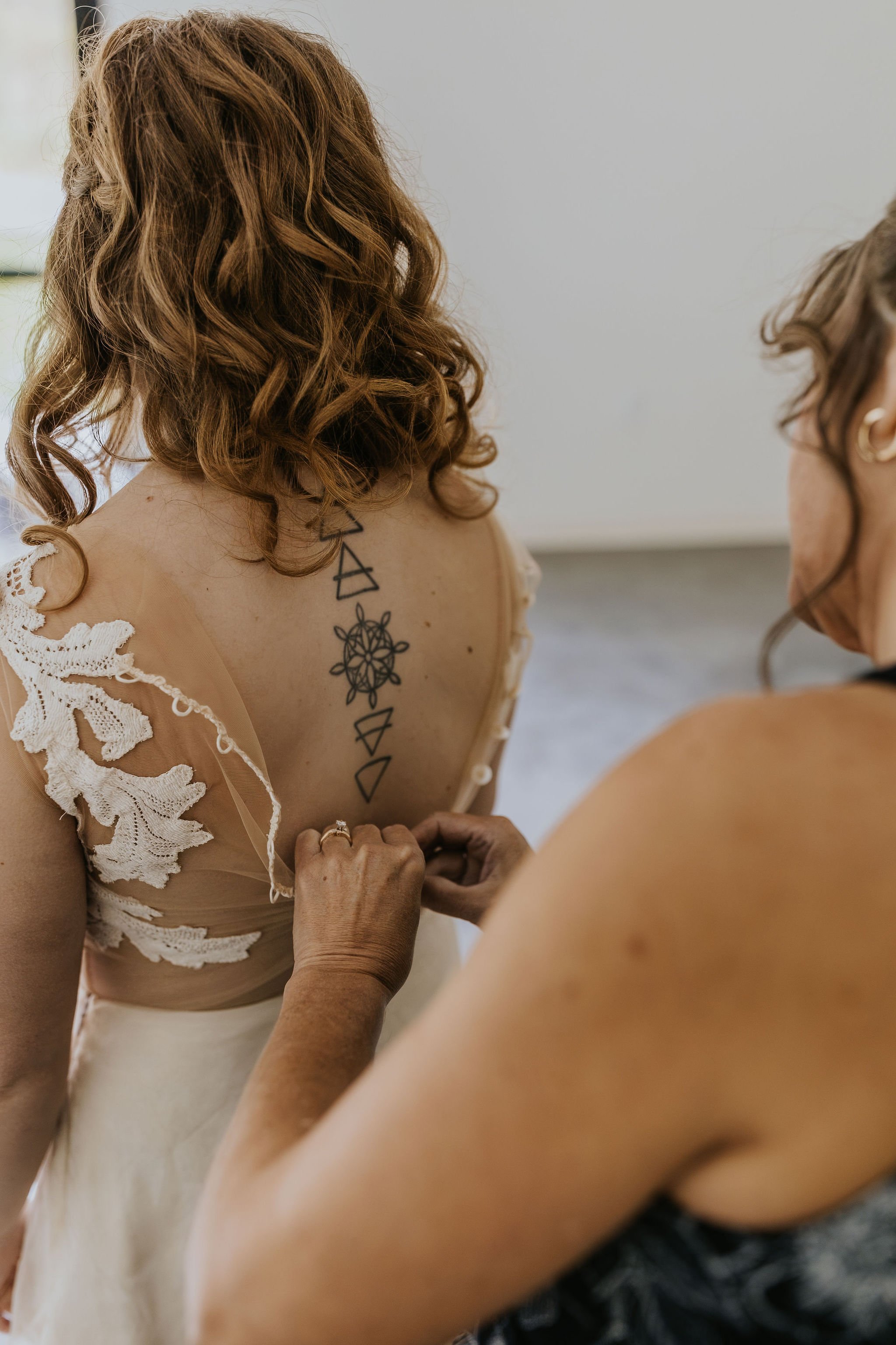 tattooed-bride-wearing-lace-bodysuit-wedding-skirt-outdoors.jpg