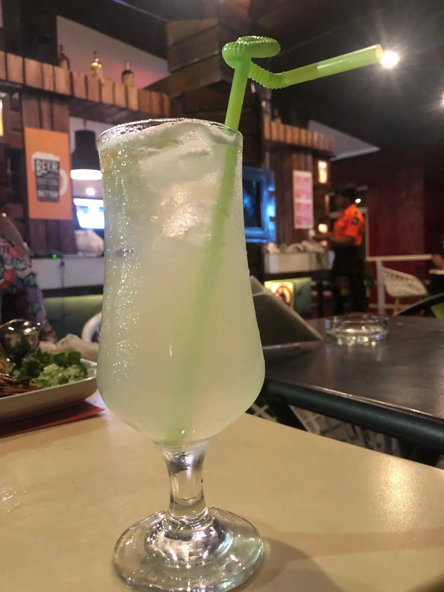 Coconut Sour in a hurricane glass