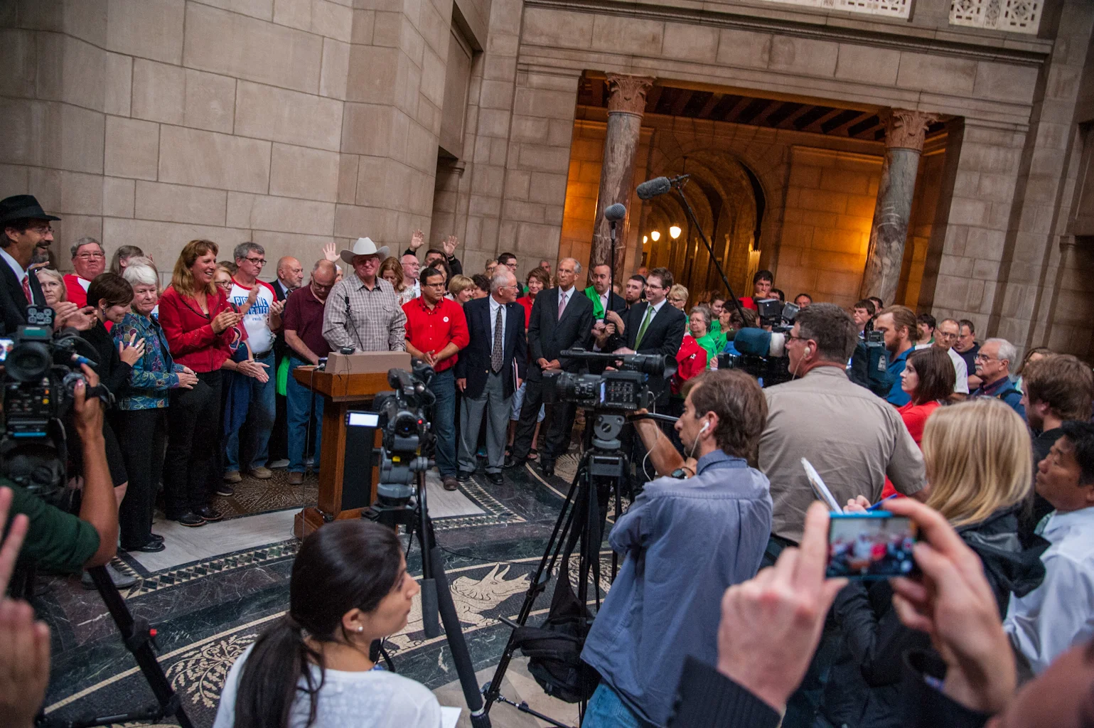   Media gathers in the Capitol rotunda after the Nebraska Supreme Court hearing on September 5, 2014.  
