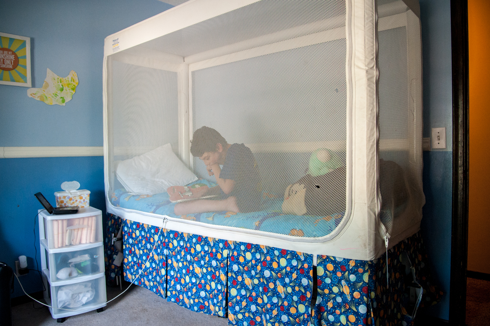  A netted bed prevents Logan from wandering off during the night.&nbsp; 