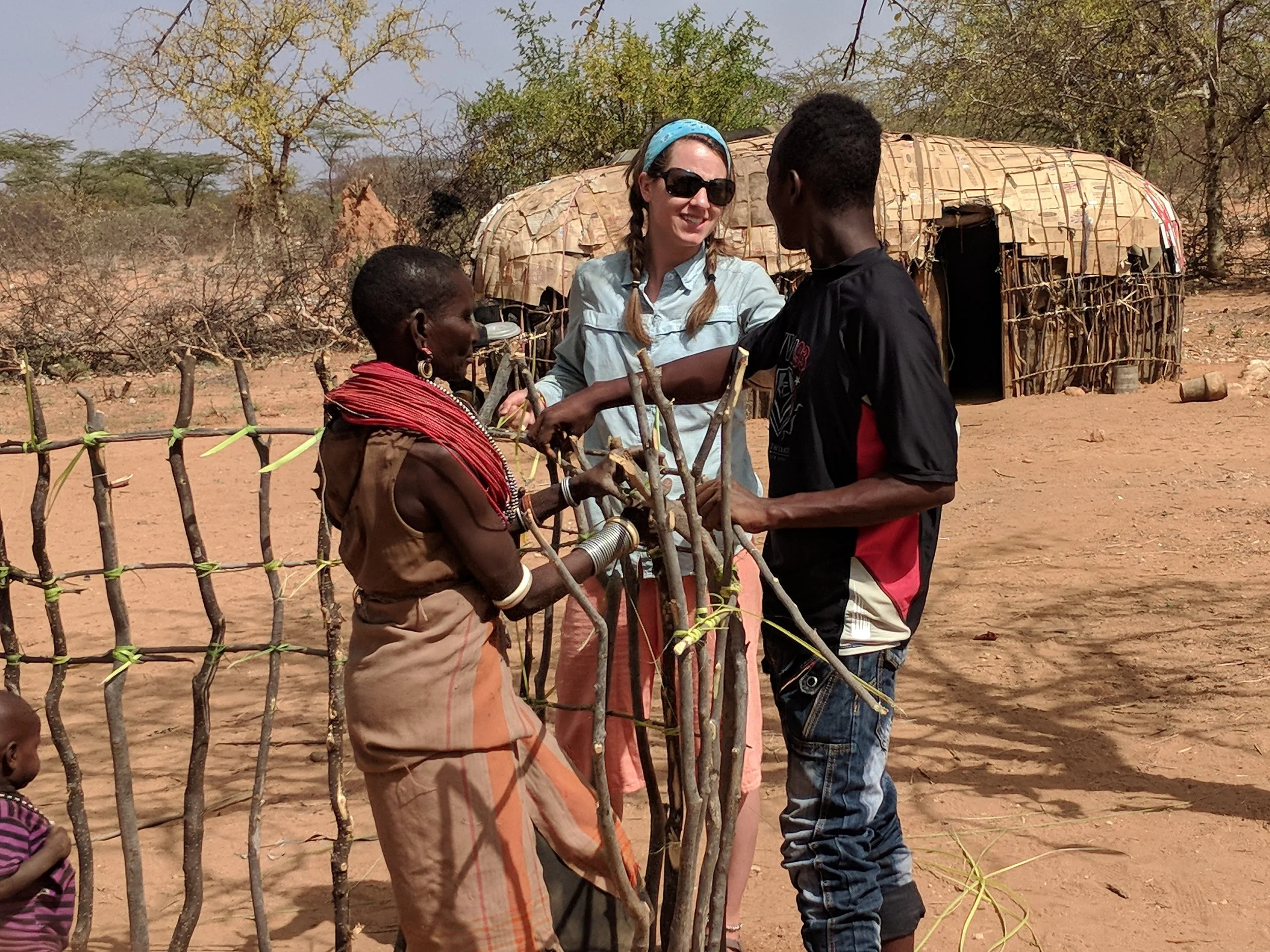Samburu, Kenya: Tomorrow we head off with twelve students from Colorado State University on a two-week service learning trip to Samburu, Kenya. This will be my seventh time co-leading the trip which focuses on building relationships, listening to what the community needs, and generally broadening horizons. Here’s a shot from last year of when we helped re-construct a boma, or house, for an older woman in the community.