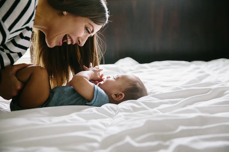 Mom laughing with baby