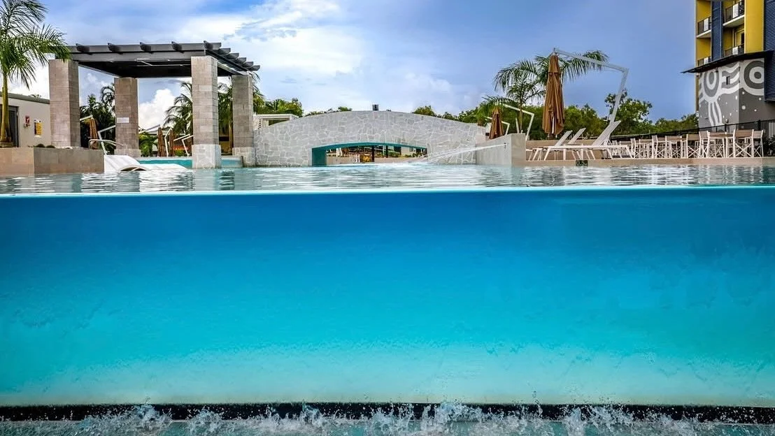 Resort style, timeless finishes. Pebblecrete &mdash; perfectly applied for Darwin&rsquo;s tropical lifestyle. 🌞 @crystallinepoolinteriors @clarkpoolinteriors @blueglasspebblecompany #ResortStyle #PebblecretePools