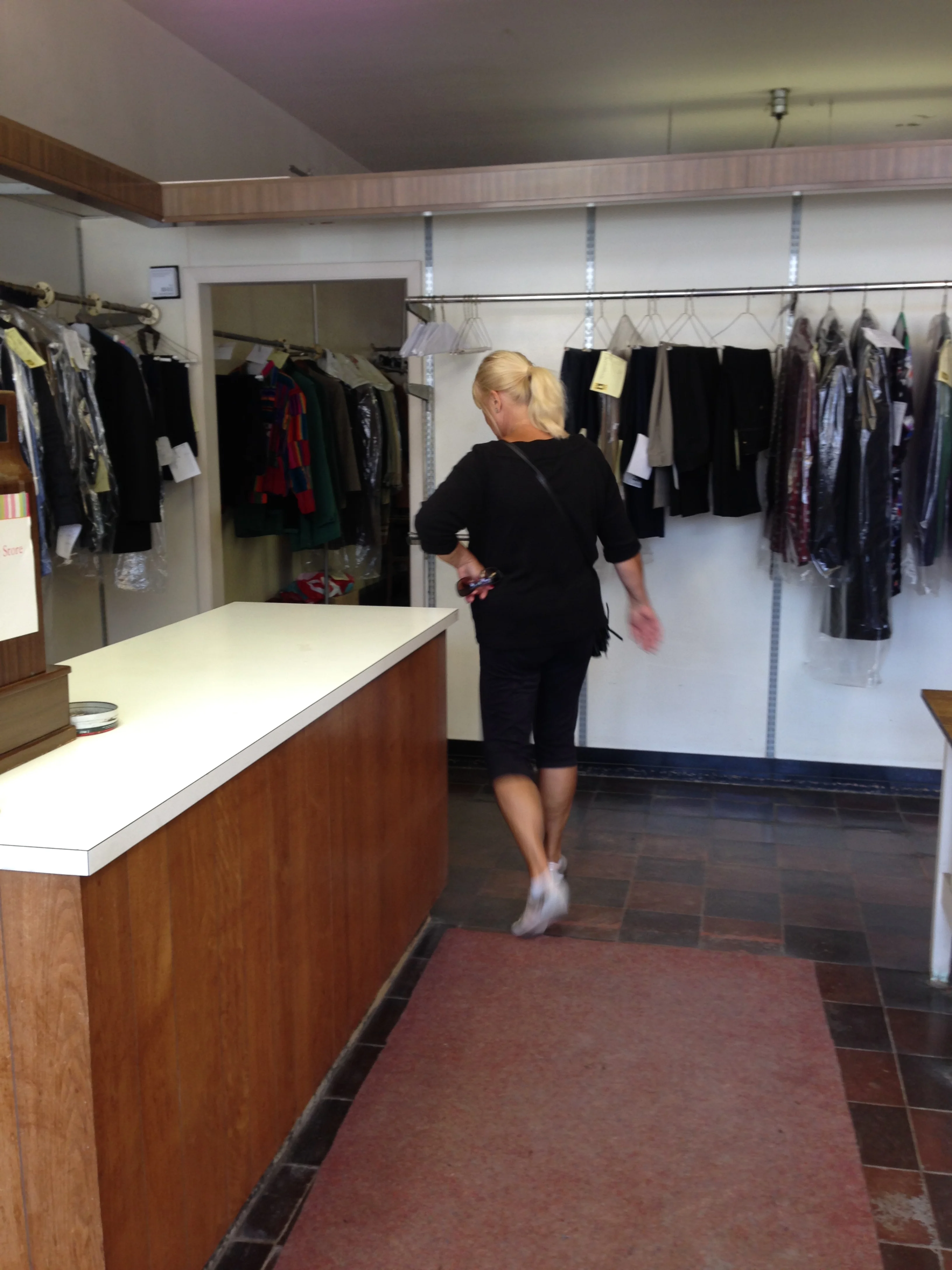 My lovely mother in the front of the store, pre-renovation.