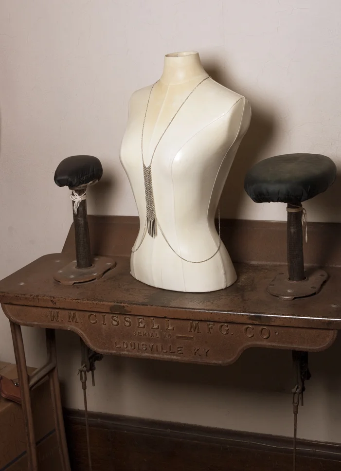 An old pressing machine, steam used to come through the poles for pressing garments. Photo by Cate Hrobsky