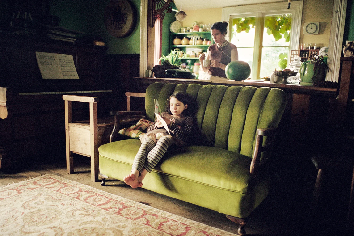 "We balance the program with a routine of structured workbooks in the morning, and natural learning, mostly through conversation, as the day progresses. It is nice to have that time in the afternoon when the children can explore their interests at their own pace. When a child asks questions they are ready to absorb that information." Cynthia Osborne and her daughter Sunshine at home. Sheffield, Tasmania.