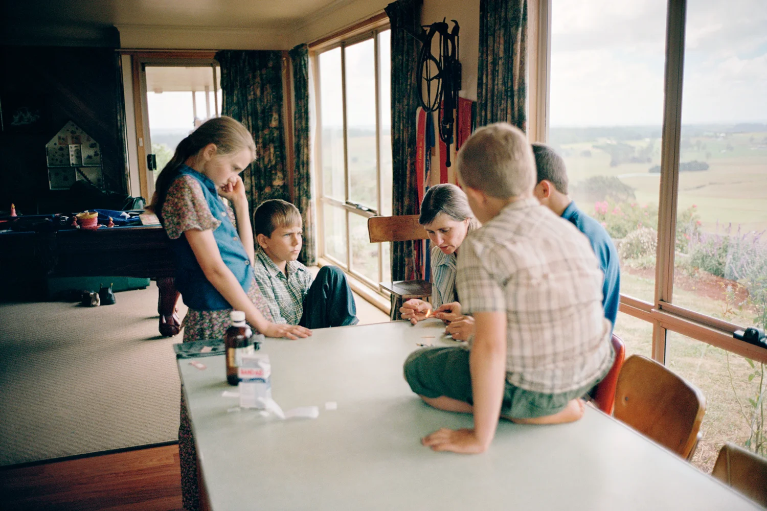 "We like to keep the kids away from peer pressure and bad influences, like television and the Internet, which can cause even good kids to get into things they shouldn't, effecting them in the long term. We found that the encouragement of good character, morals and standards is lacking in schools. With home schooling we can guide their steps all the way." Traci Milburn with her children Bonnie, Hudson, Joseph and Brock at home. Irishtown, Tasmania.