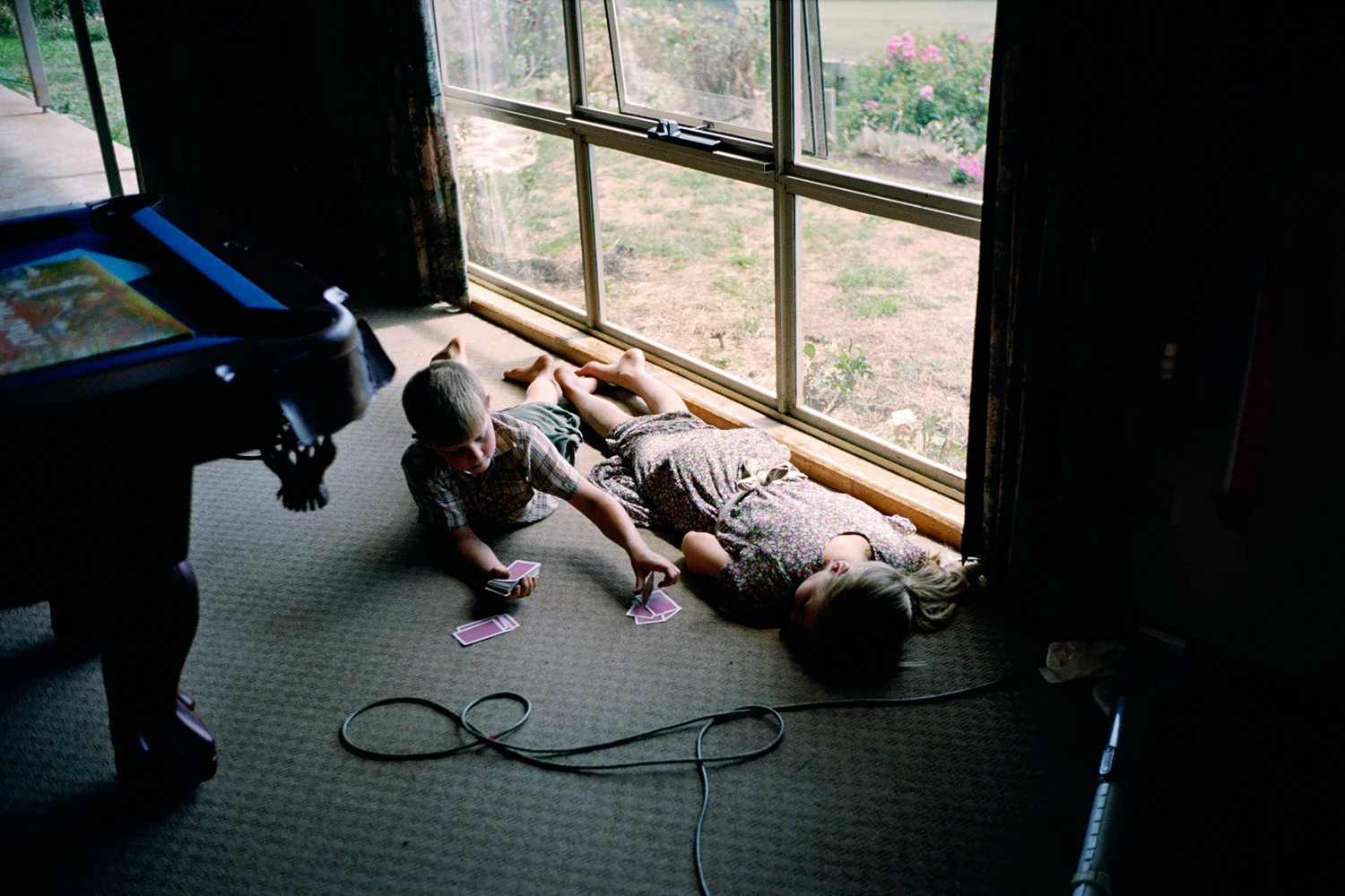 Joseph and Bonnie Milburn playing cards during a break from their studies at home. Irishtown, Tasmania.