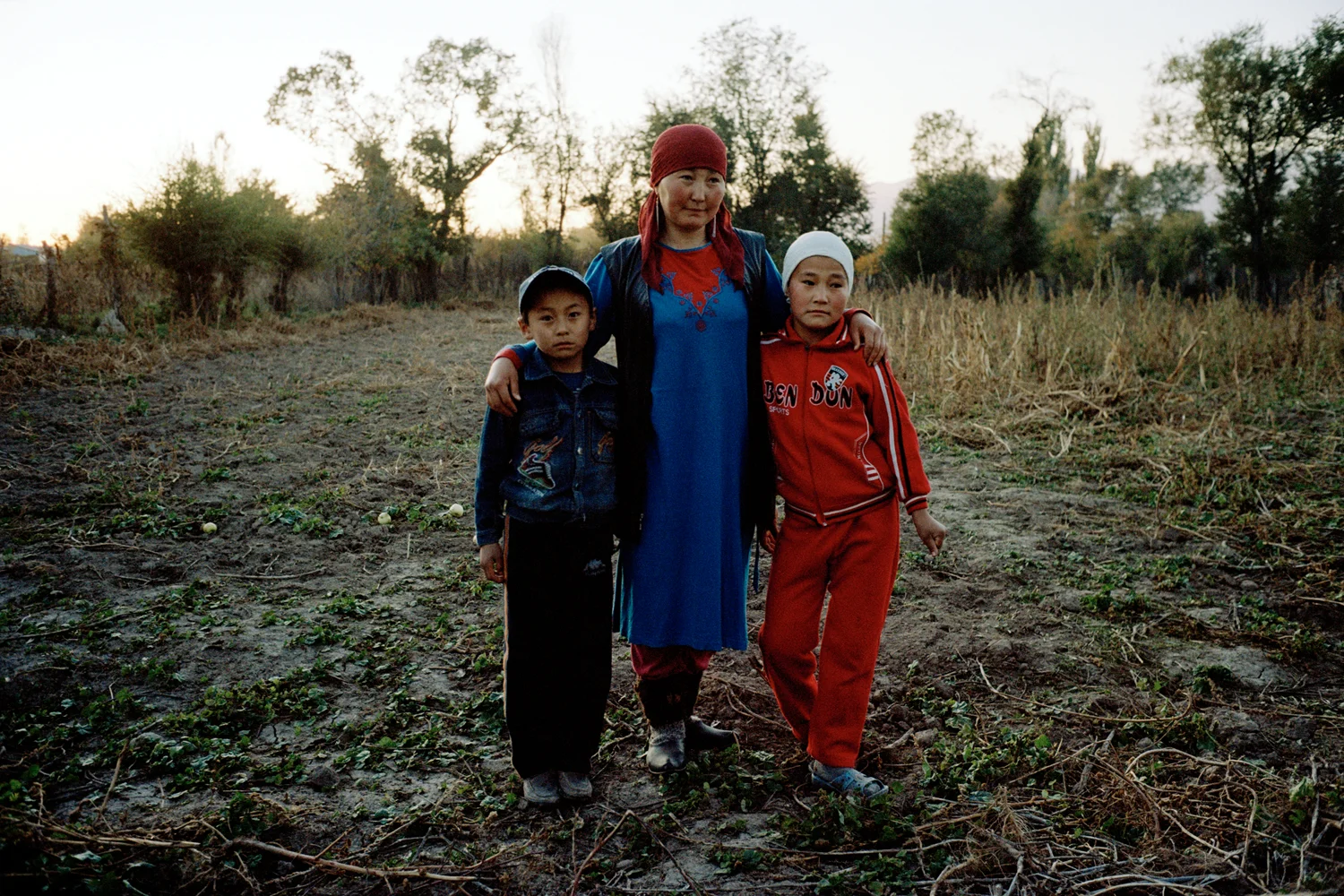 Aizada was kidnapped at 17 by a stranger. She has two children by him, Doolotbai and Bermet. They no longer live together and he threatens her with violence almost daily. His family want him to find another wife because Aizada suffers from a heart condition. Because kidnapped marriages are rarely registered, the bride has almost no rights to property or children. Issyk-Kul Oblast, Kyrgyzstan.