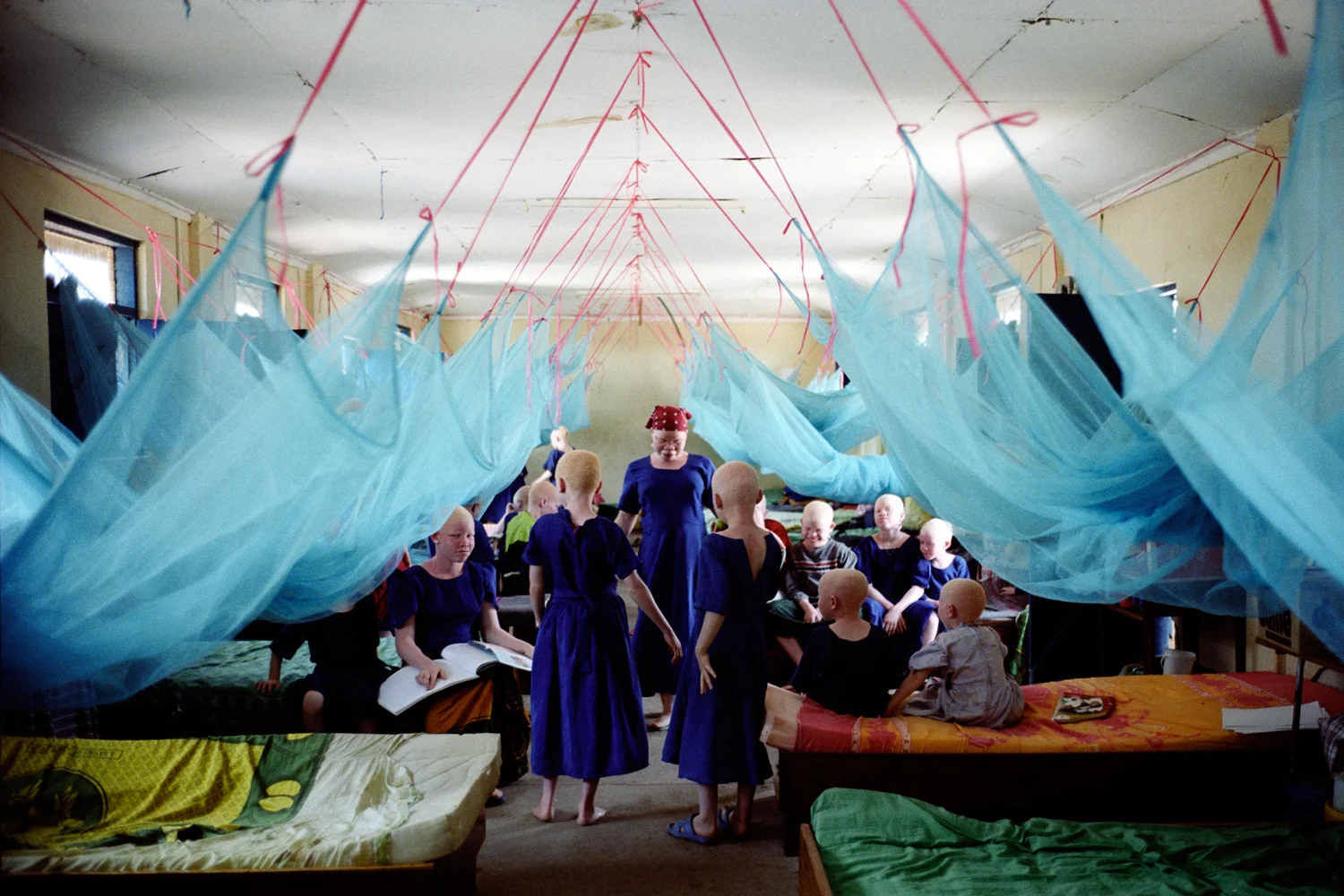 Inside the girls dormitory at Mitindo Primary school. In March 2007, in response to the killings, the Tanzanian government moved all children with albinism in the Mwanza area to Mitindo boarding school feeling it could not properly protect them at home in remote areas. There are 62 children with albinism at the school all of which are being kept at school over the holidays for their own safety. Misungwi, Mwanza, Tanzania. 