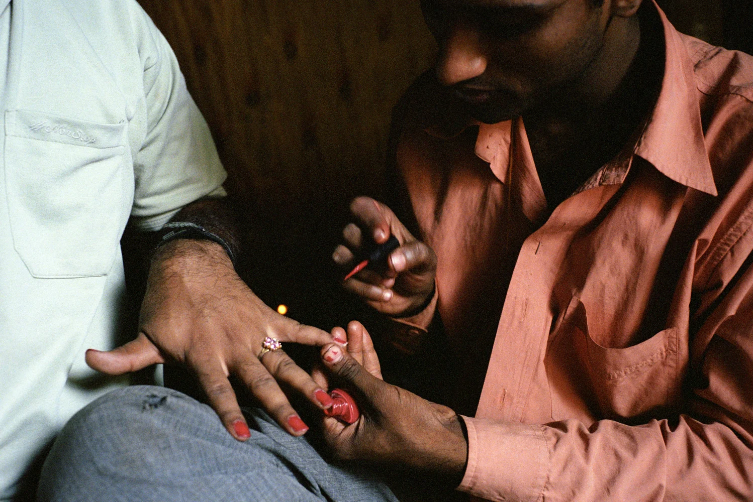 Pandu, a Jogappa paints his friend Sudhir's nails in the privacy of Pandu’s house. In a country where homosexuality carries huge stigma Jogappas can wonder freely dressed in saris and behaving effeminately without fear of discrimination.