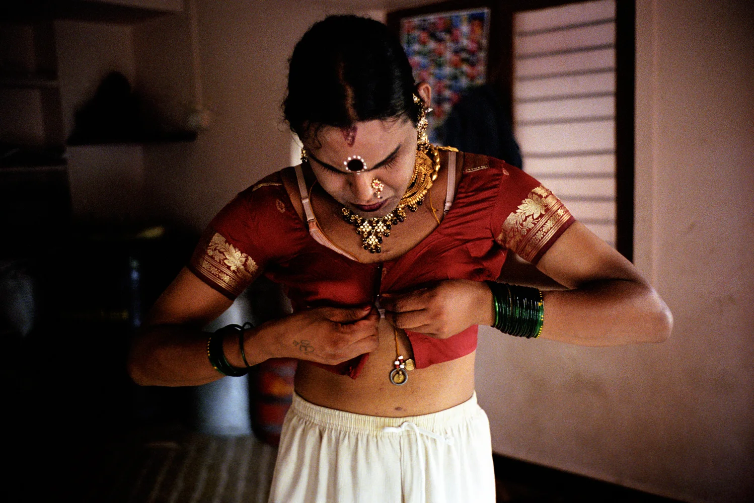 Dinesh dresses for the Shravan (month of August) holy festival where he will dance with the guru Baskhar and other jogappas.