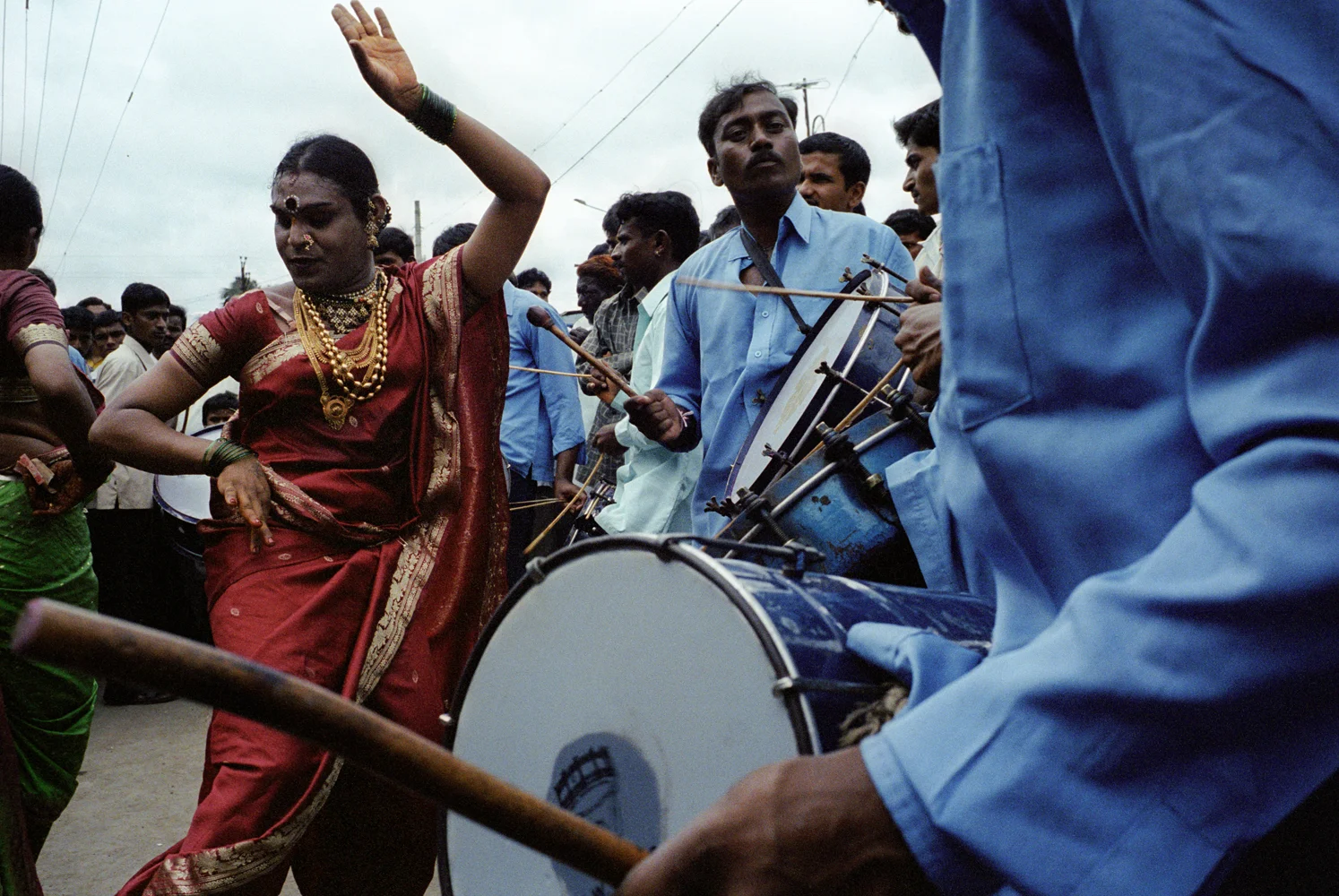 Dinesh dances for a crowd at the Shravan (the holy month of August) festival. Jogappas are considered to be very auspicious and always dance at festivals and on holy days. They earn a good living in this way.
