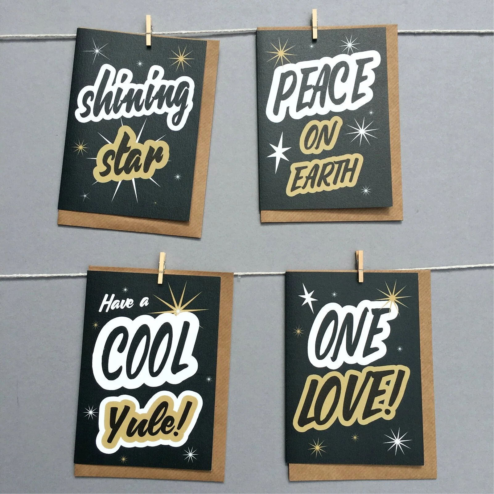 Typographic slogan Xmas card set by Lou Boyce