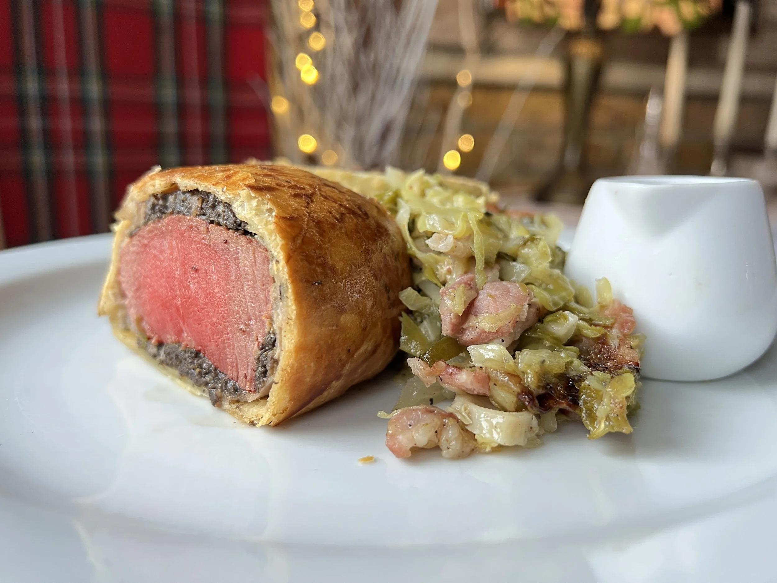 Beef Wellington, hispi cabbage, red wine jus