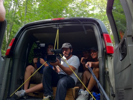 setting up a tracking shot from a van. In the picture from left to right. Dillon Ward, Ezra Bookstein, Me (in the shadows directing), Peter Markle, our teacher (booming for sound)