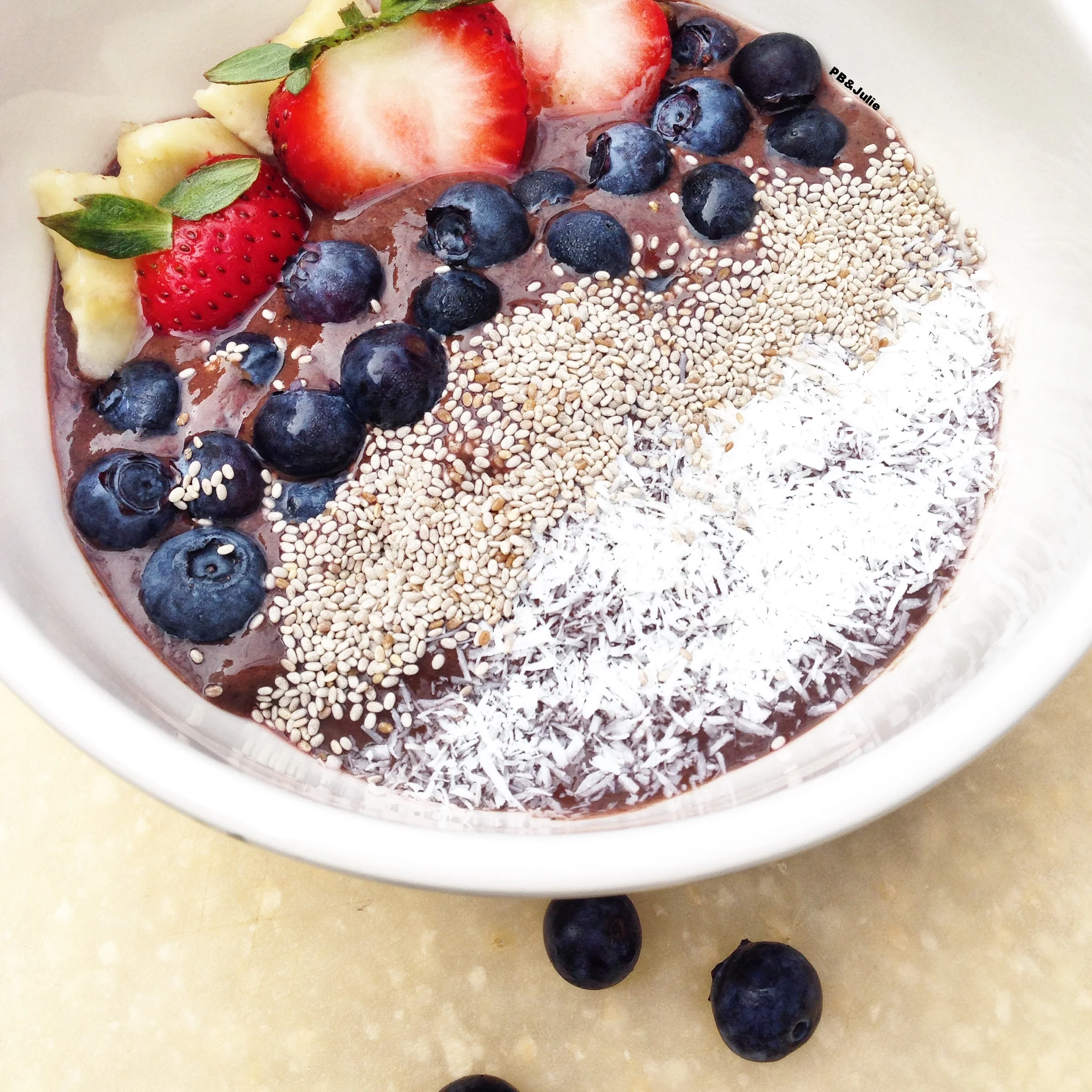 PB&Julie's Mango Acai Bowl with fresh organic berries, omega rich chia seeds and satisfyingly tropical coconut shreds. Love your body.