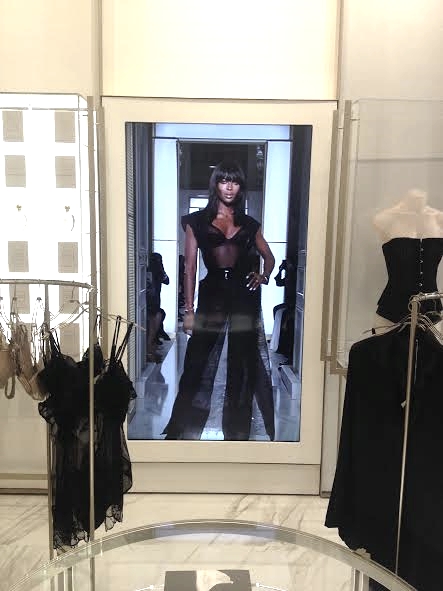  The La Perla showroom has a life-sized screen that plays their latest runway shows from Paris and Florence. It comes through on&nbsp;a live feed from Italy! And yes darlings, that's Miss Naomi Campbell, supermodel! 