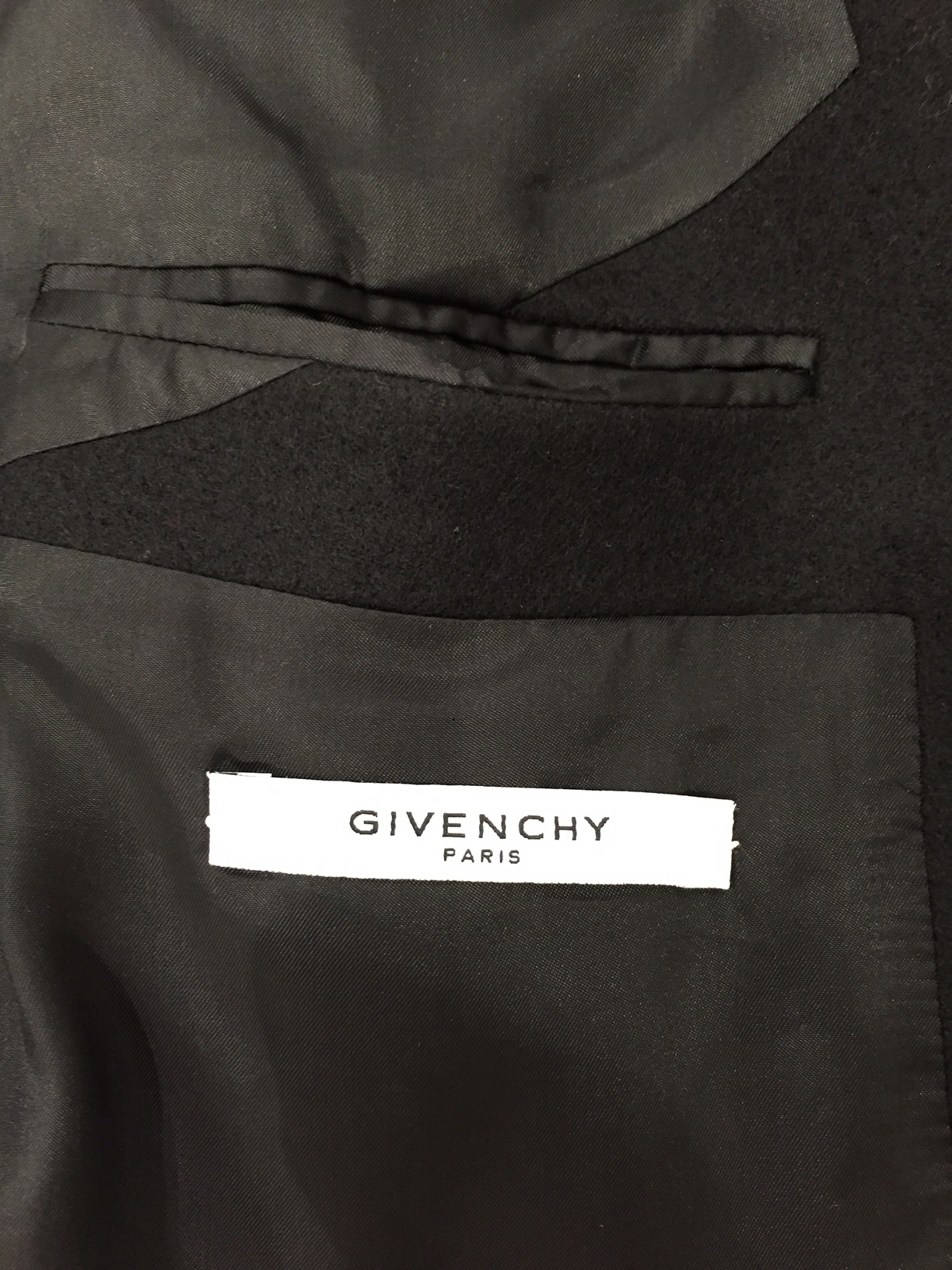  This is the Givenchy wool coat with the leather sleeves. You'll turn heads with this one.&nbsp; 