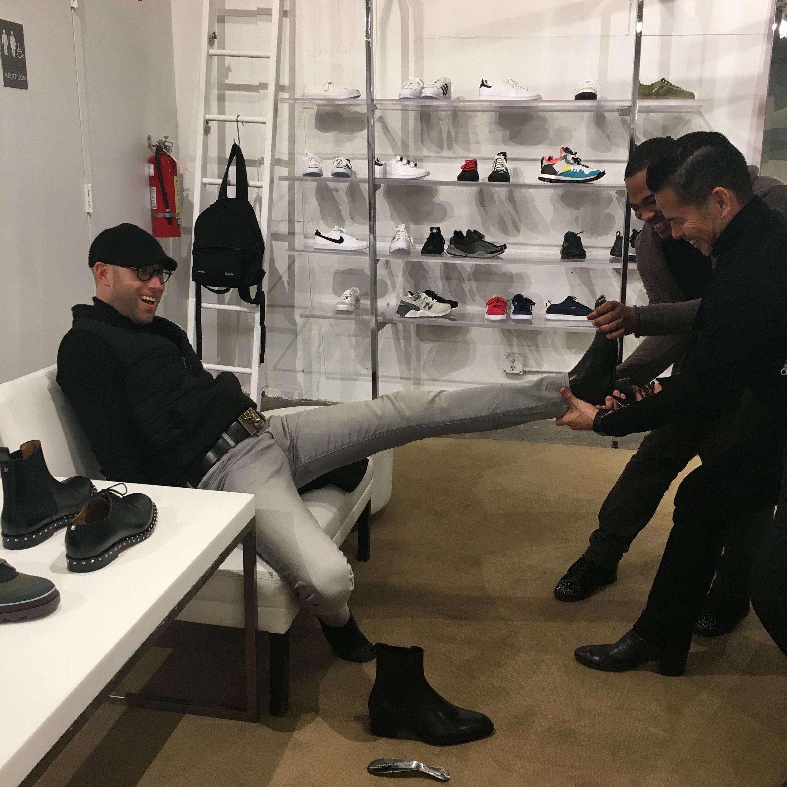 Alex needed assistance taking off the Saint Laurent boots he was trying on at Jeffrey.