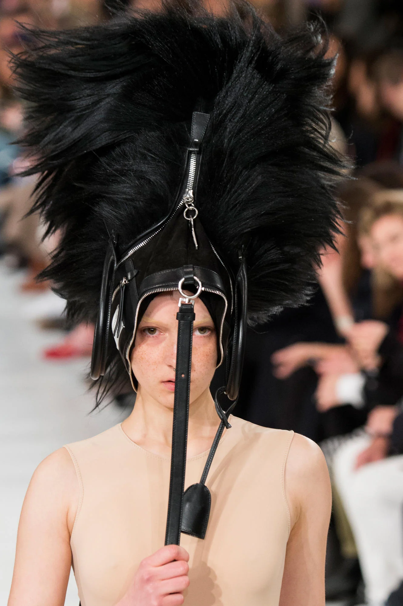 MAISON MARGIELA'S FALL RUNWAY FEATURED FEATHERS AS MAKEUP AND HANDBAGS AS HAIR ACCESSORIES