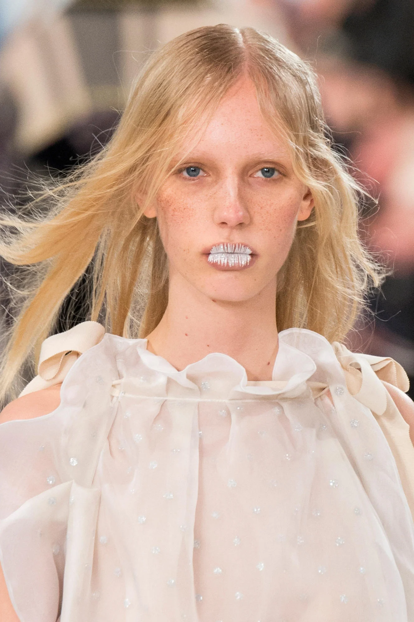 MAISON MARGIELA'S FALL RUNWAY FEATURED FEATHERS AS MAKEUP AND HANDBAGS AS HAIR ACCESSORIES