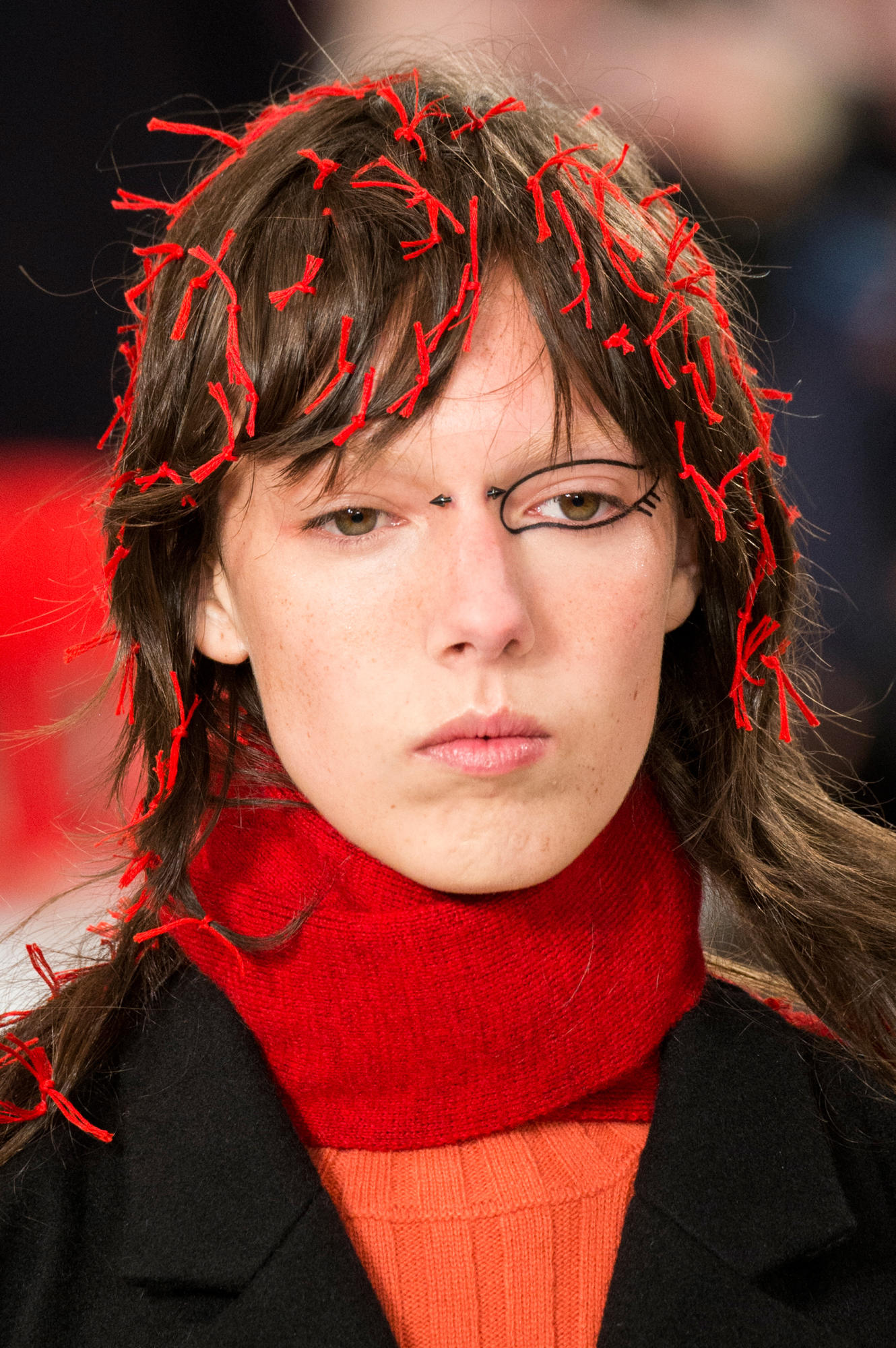 MAISON MARGIELA'S FALL RUNWAY FEATURED FEATHERS AS MAKEUP AND HANDBAGS AS HAIR ACCESSORIES