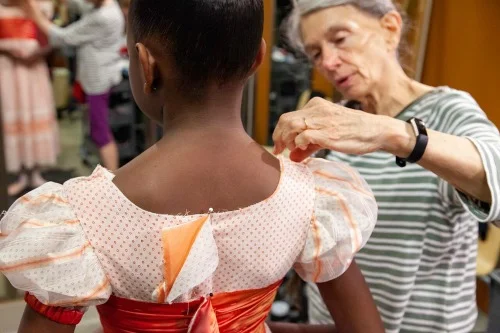 A costume fitting with designer Sandra Woodall. Photo: Kim Kenney