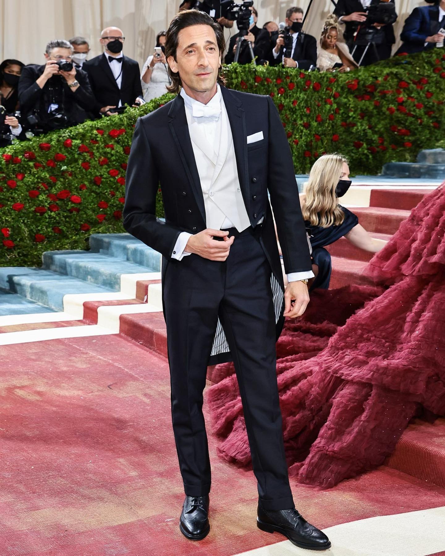 Adrien Brody wears a classic white tie tailcoat in 3-ply mohair, white tie vest in silk faille, classic trousers in 3-ply mohair and classic wing collar shirt with french cuffs in pique.