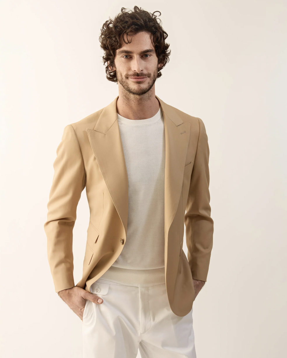 “Model wearing Frederick Anderson’s new menswear look—chic, modern tailoring with innovative textures.”