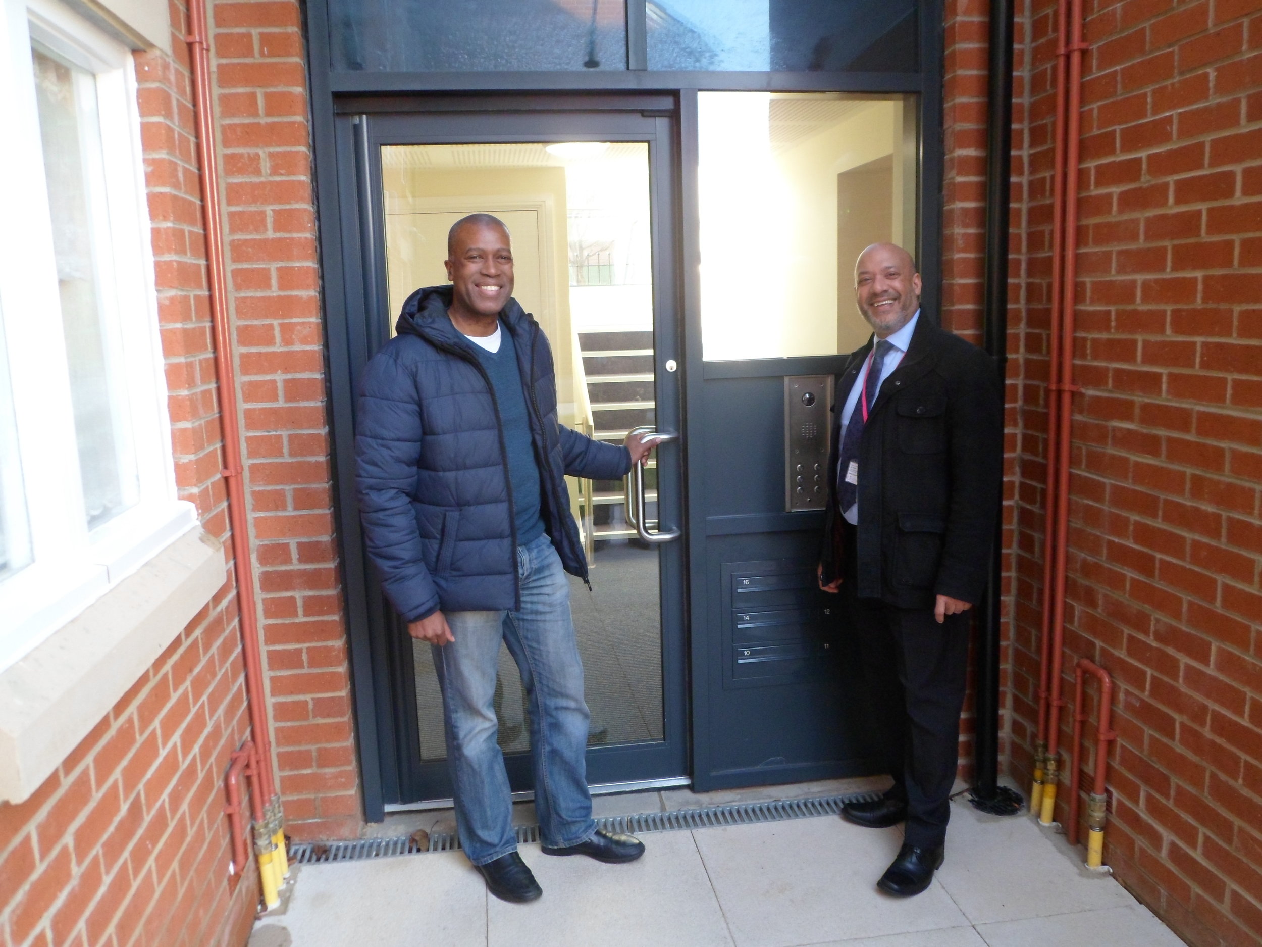Unity chief executive Ali Akbor (right) with tenant Ian Bailey at the new Holborn Court development