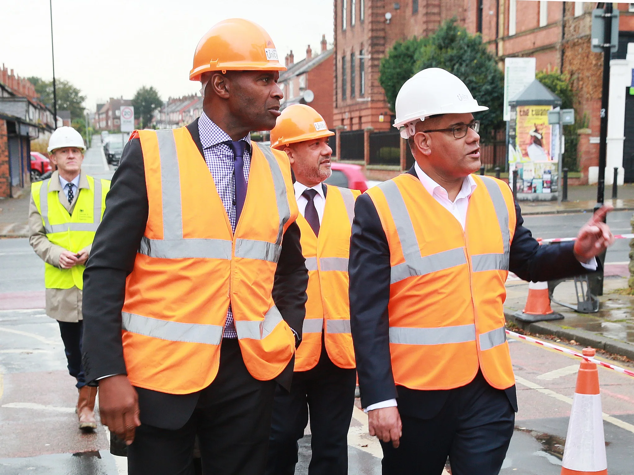 From right to left: Housing and Planning Minister Alok Sharma, Unity chief executive Ali Akbor and Unity regeneration director Wayne Noteman arrive at the soon-to-be-completed 146 Chapeltown Road affordable homes development in Leeds