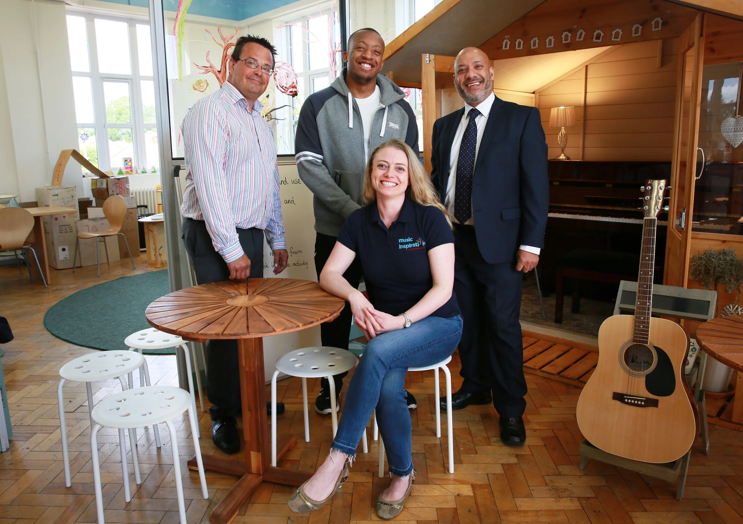 Ruth Douglas with (from left to right) Adrian Green (Unity Enterprise manager), Ali Akbor (Unity Homes and Enterprise chief executive) and Michael Kamara (C’Town Studio owner) at Inspirations Central