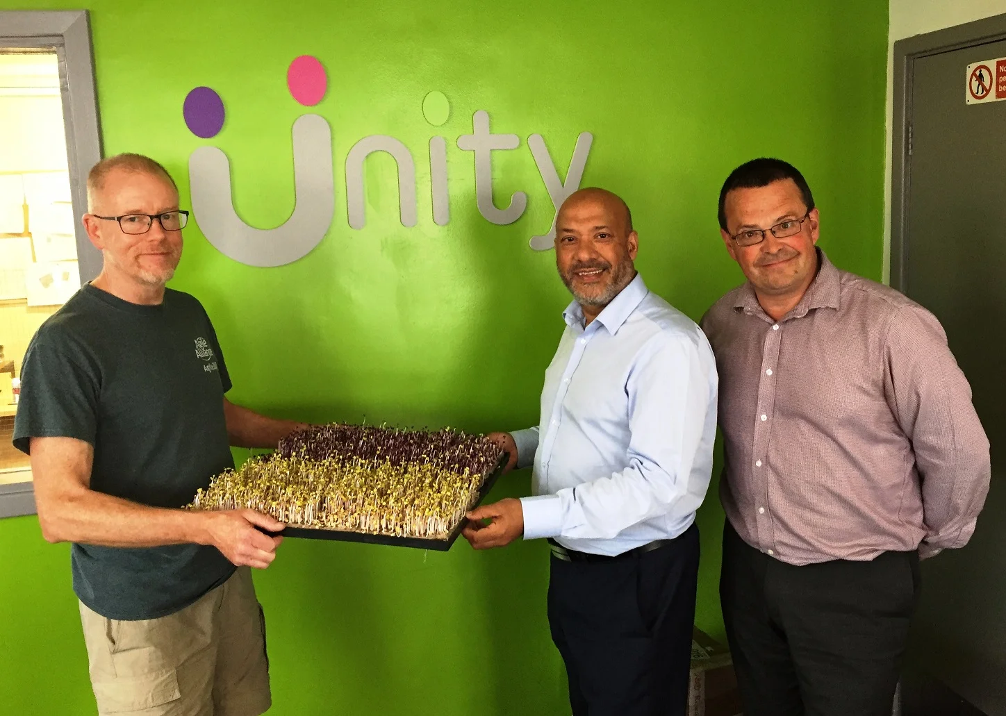 From left to right: Growing Better founder and chief executive Rob Moores at Unity Business Centre with Unity Homes and Enterprise chief executive Ali Akbor and Unity Enterprise manager Adrian Green