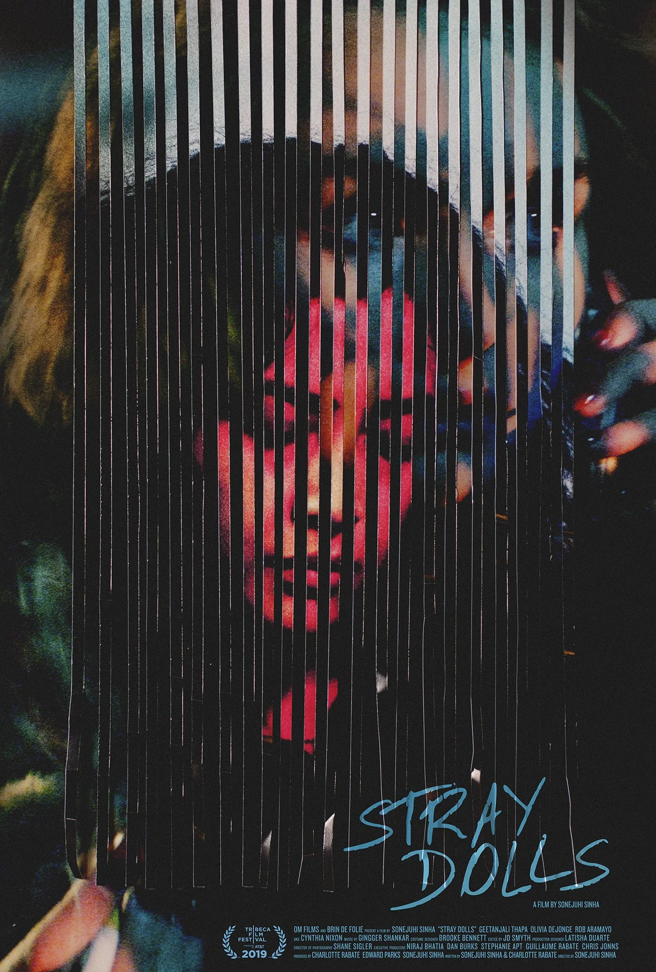 Poster of the film 'Stray Dolls' featuring a woman with short hair and sunglasses behind vertical lines, with the title and credits at the bottom.