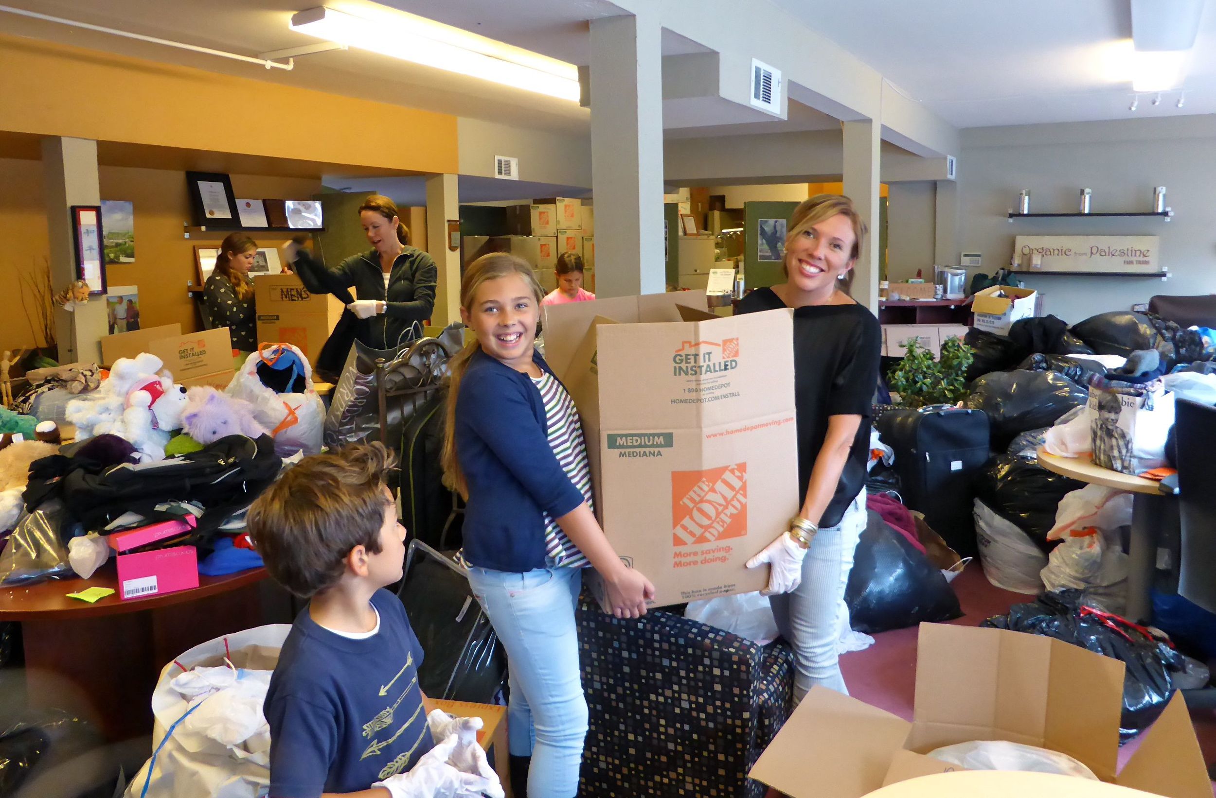 Hundreds of donations, volunteers came to sort, pack copy.jpg