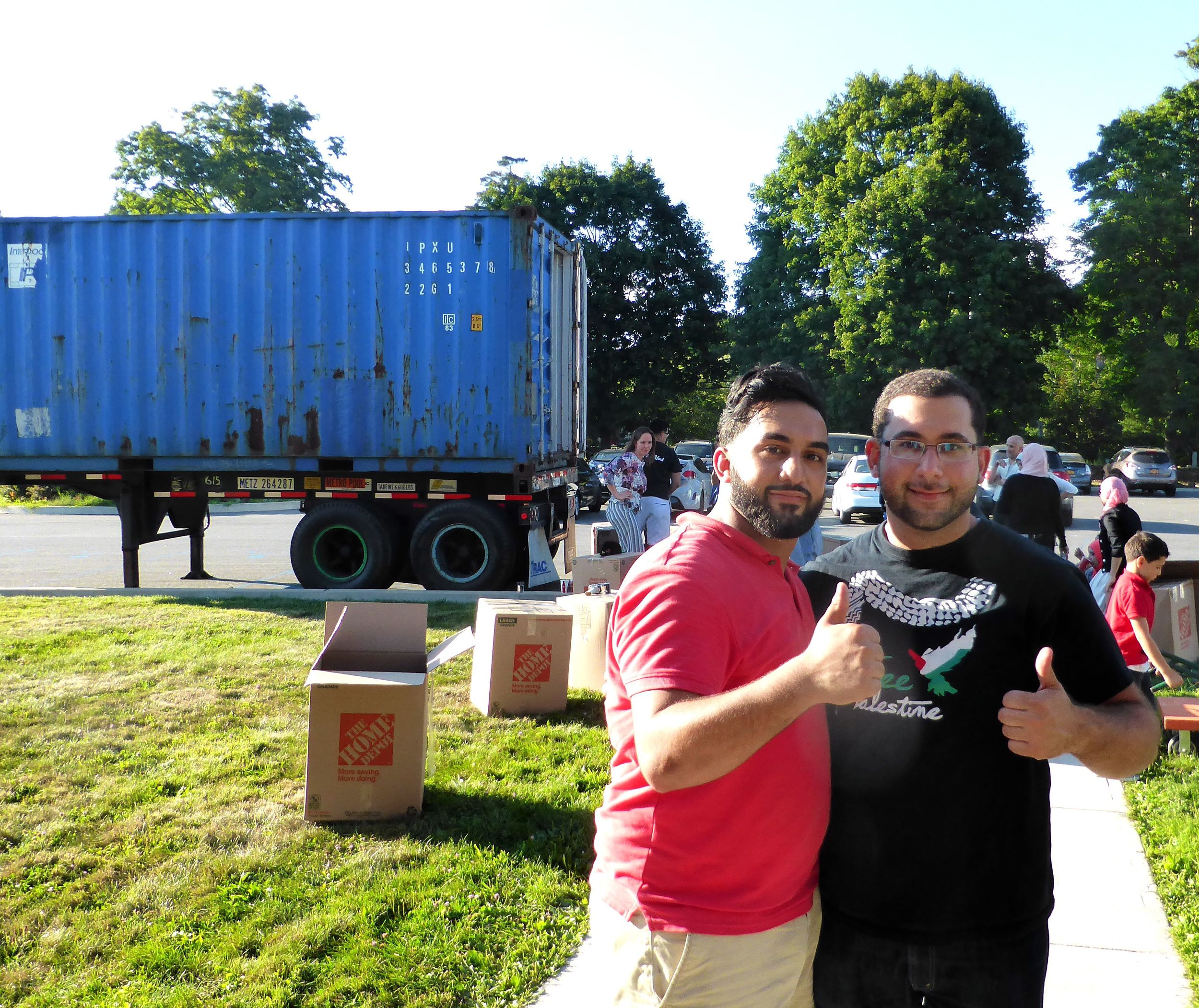Our New Jersey Coordinator, Adam, and volunteer Ahmed load the shipping container in Mohegan Lake, NY. 