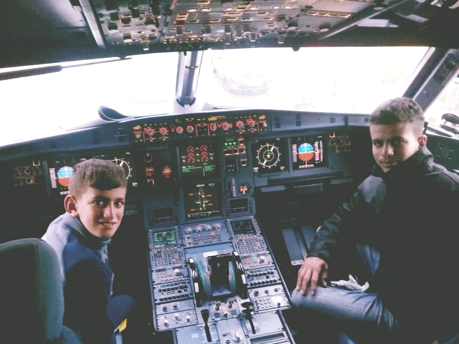 Ahmed and Ayser, in the cockpit before taking off for the United States