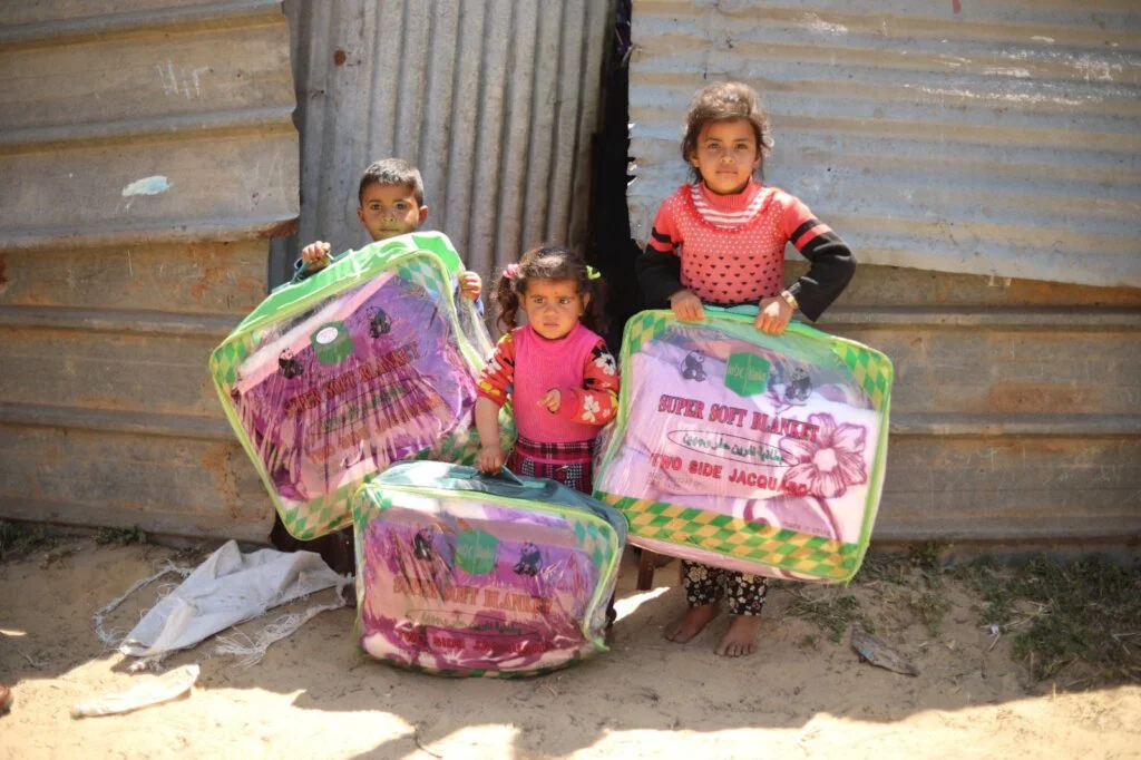 No roof or wall. A blanket from you kept a Gaza family warm this winter